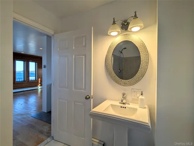 a bathroom with a sink and a mirror