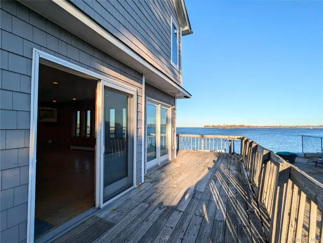 a balcony with wooden floor