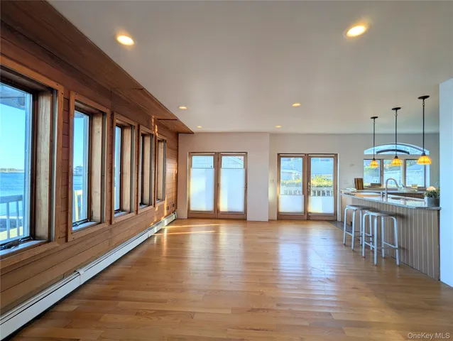 a view of an entryway with wooden floor