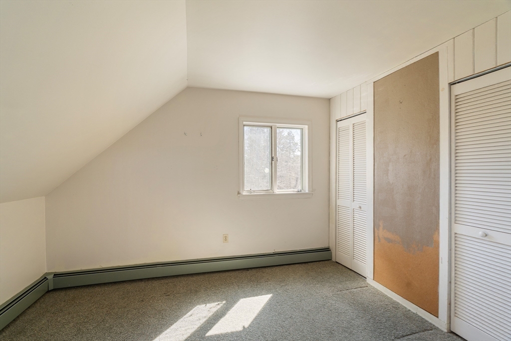 24 Beetle Swamp Road Edgartown, MA 02539 - Photo 17 of 33 an empty room with windows