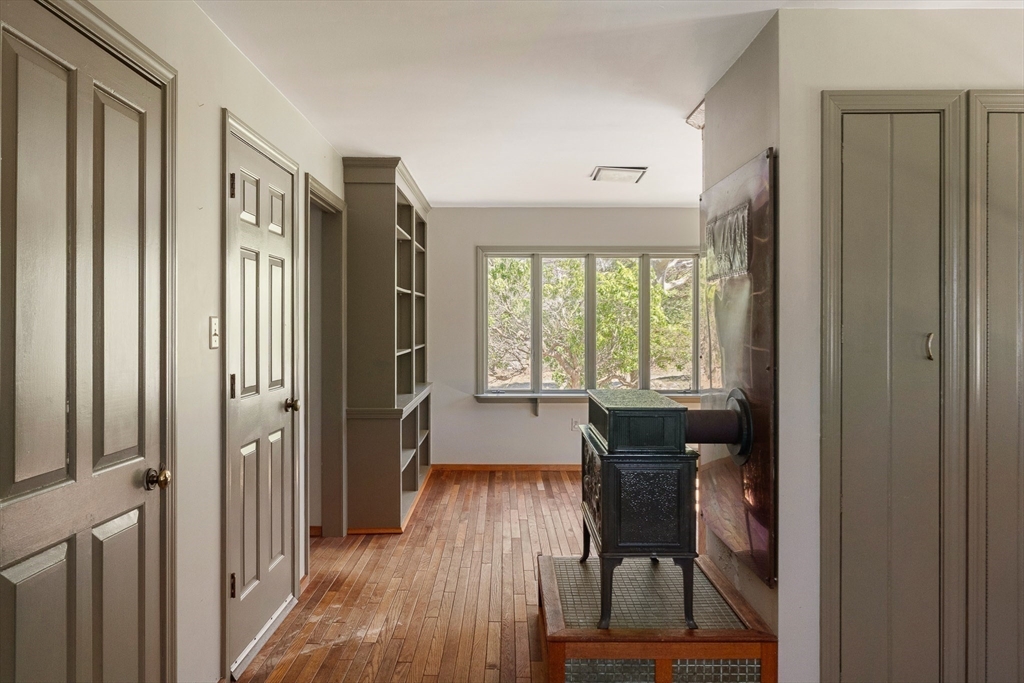 24 Beetle Swamp Road Edgartown, MA 02539 - Photo 6 of 33 a view of a hallway with furniture and wooden floor
