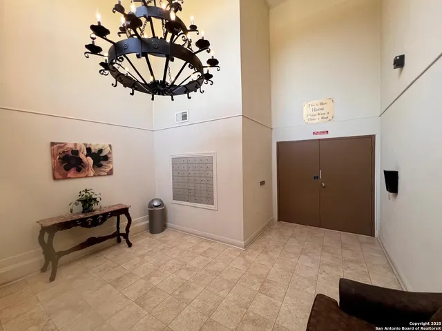 a view of a livingroom with furniture and a chandelier