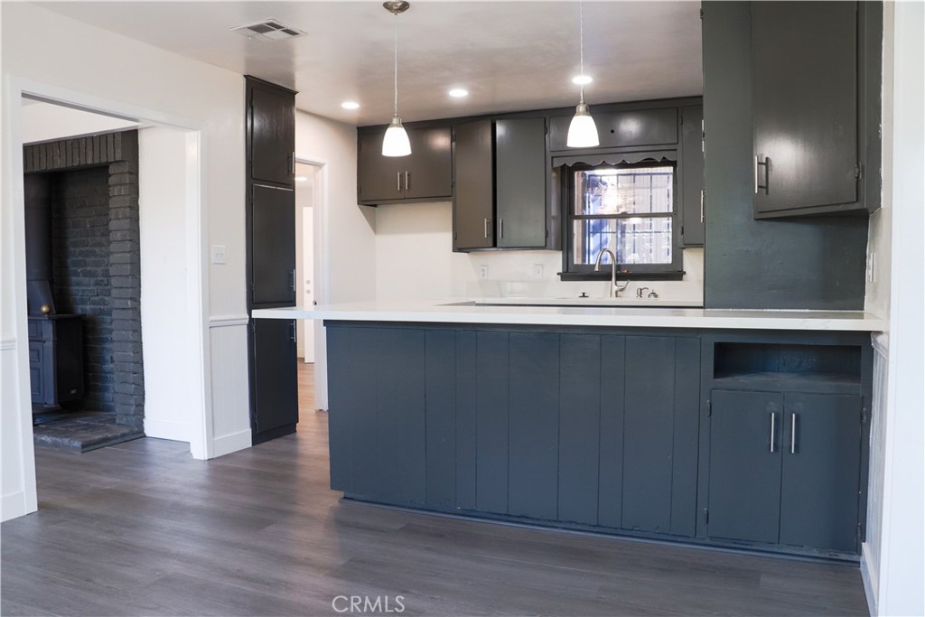 3323 Riverview Drive Jurupa Valley, CA 92509 - Photo 11 of 26 a view of a kitchen with a sink and a refrigerator