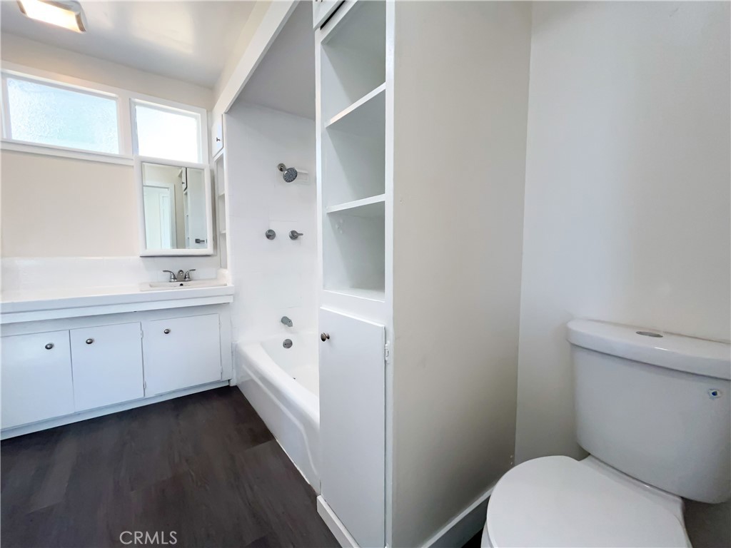 3323 Riverview Drive Jurupa Valley, CA 92509 - Photo 13 of 26 a bathroom with a granite countertop toilet sink and mirror