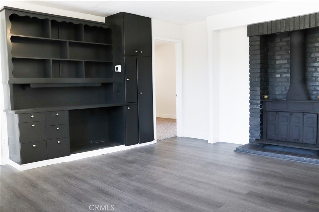 3323 Riverview Drive Jurupa Valley, CA 92509 - Photo 14 of 26 a view of an empty room with wooden floor
