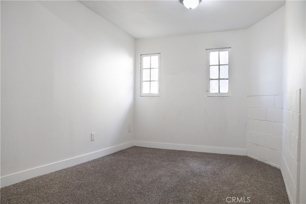 3323 Riverview Drive Jurupa Valley, CA 92509 - Photo 24 of 26 an empty room with windows