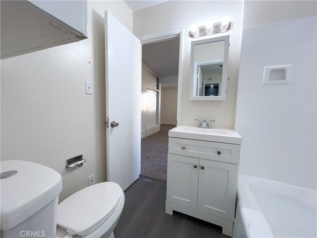 3323 Riverview Drive Jurupa Valley, CA 92509 - Photo 26 of 26 a bathroom with a sink a toilet a mirror and vanity