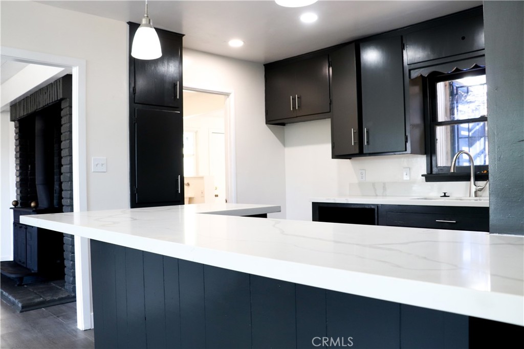 3323 Riverview Drive Jurupa Valley, CA 92509 - Photo 10 of 26 a kitchen with stainless steel appliances a sink cabinets and wooden floor