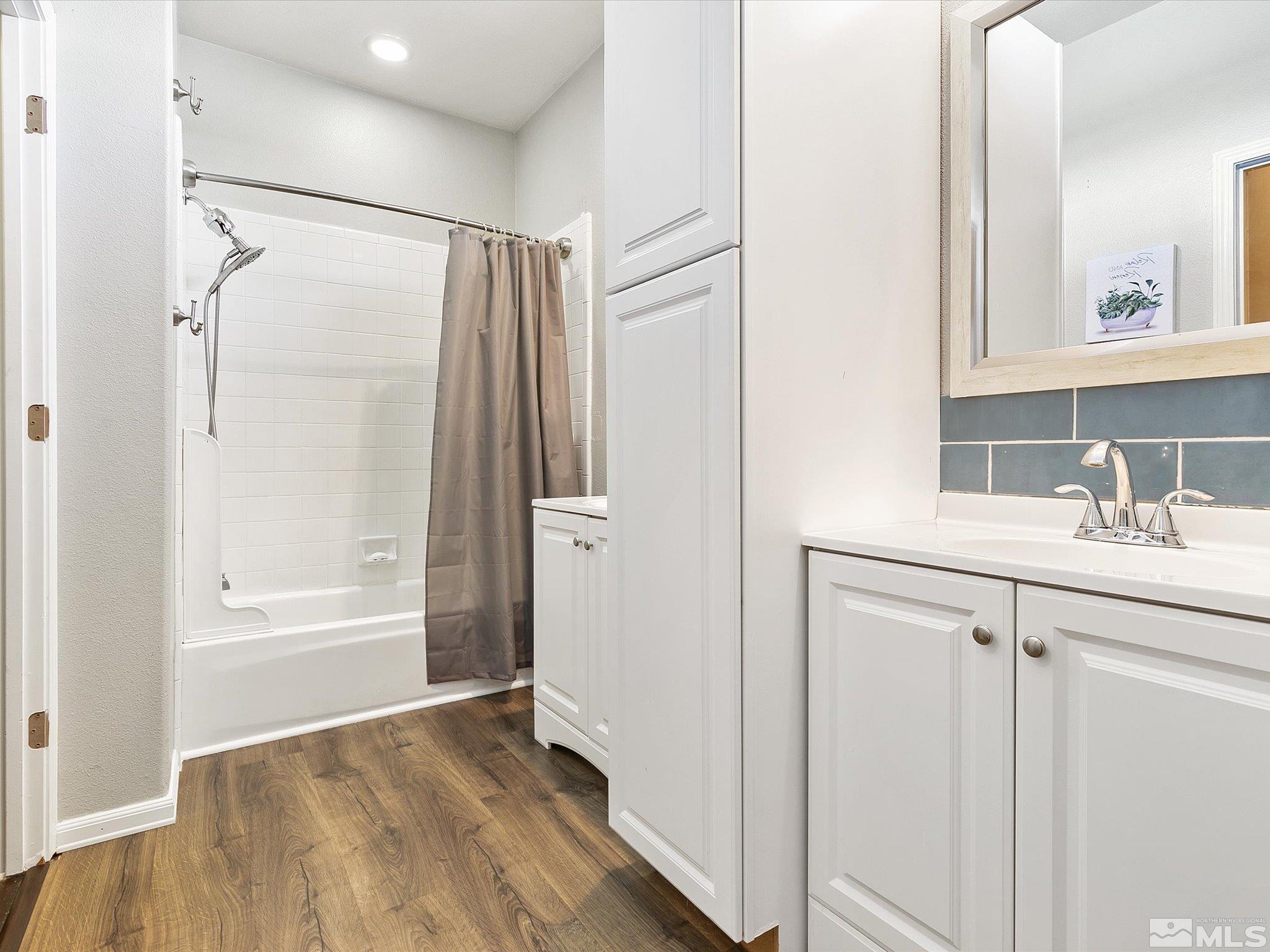 9740 Ripple Way Reno, NV 89521 - Photo 11 of 19 a bathroom with a shower sink vanity and mirror
