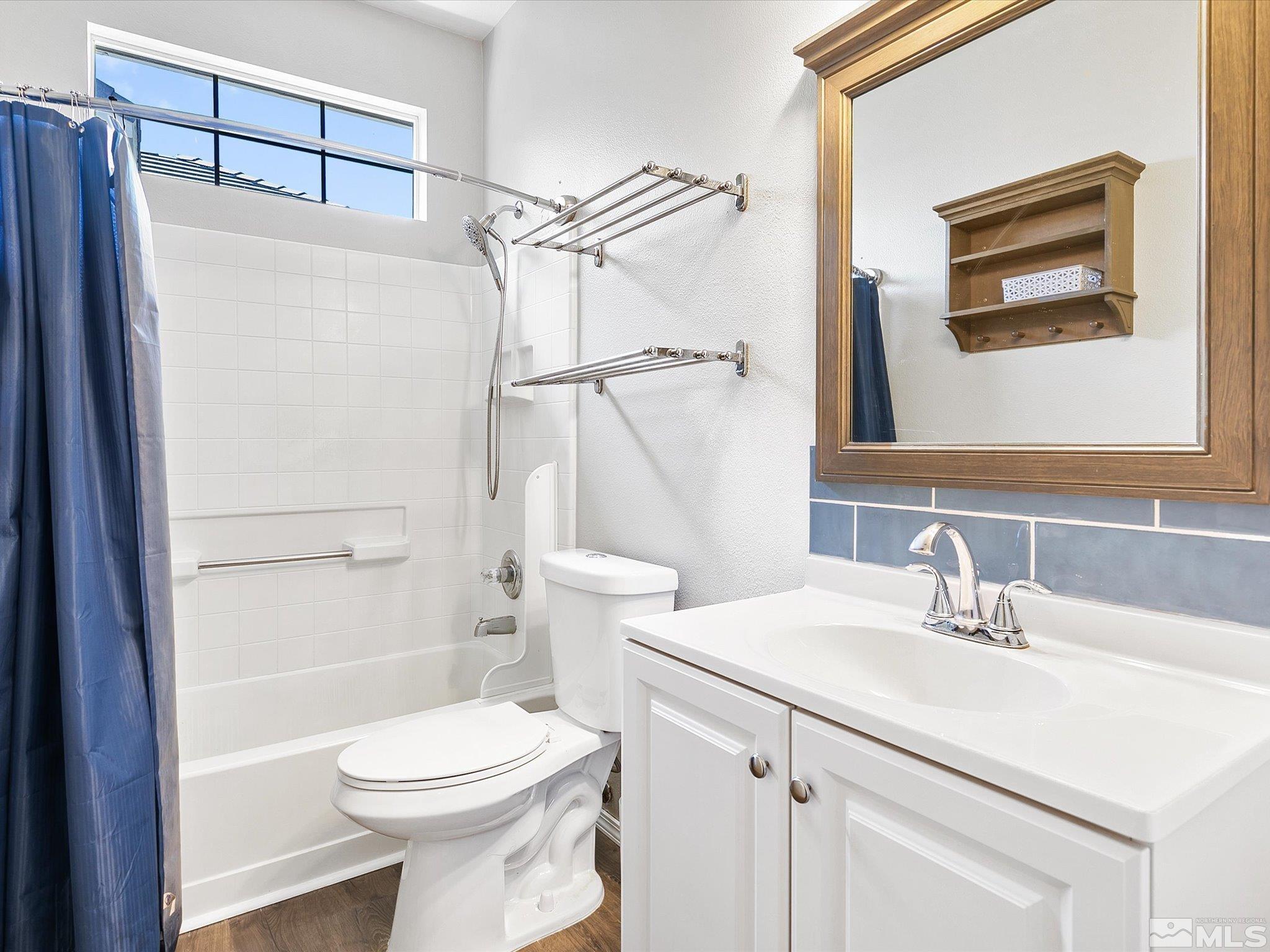 9740 Ripple Way Reno, NV 89521 - Photo 13 of 19 a bathroom with a sink toilet and shower