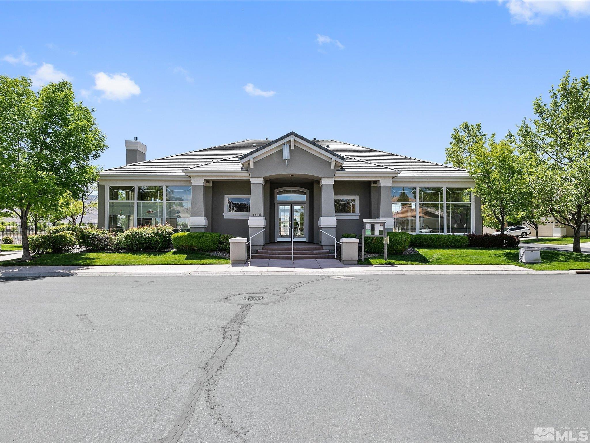 9740 Ripple Way Reno, NV 89521 - Photo 18 of 19 front view of a house with a small yard