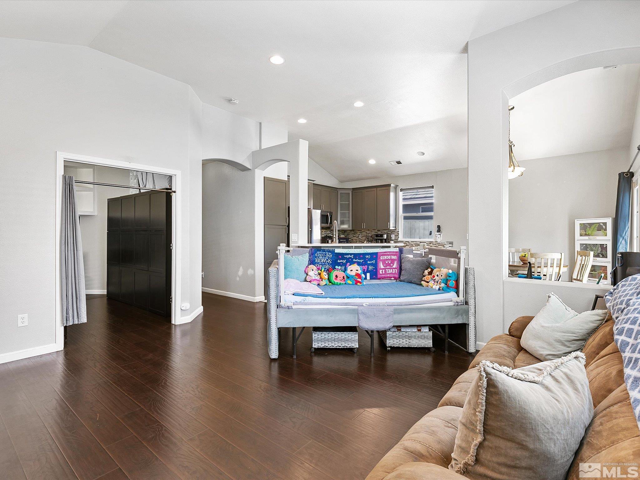 9740 Ripple Way Reno, NV 89521 - Photo 4 of 19 a room with furniture and a wooden floor