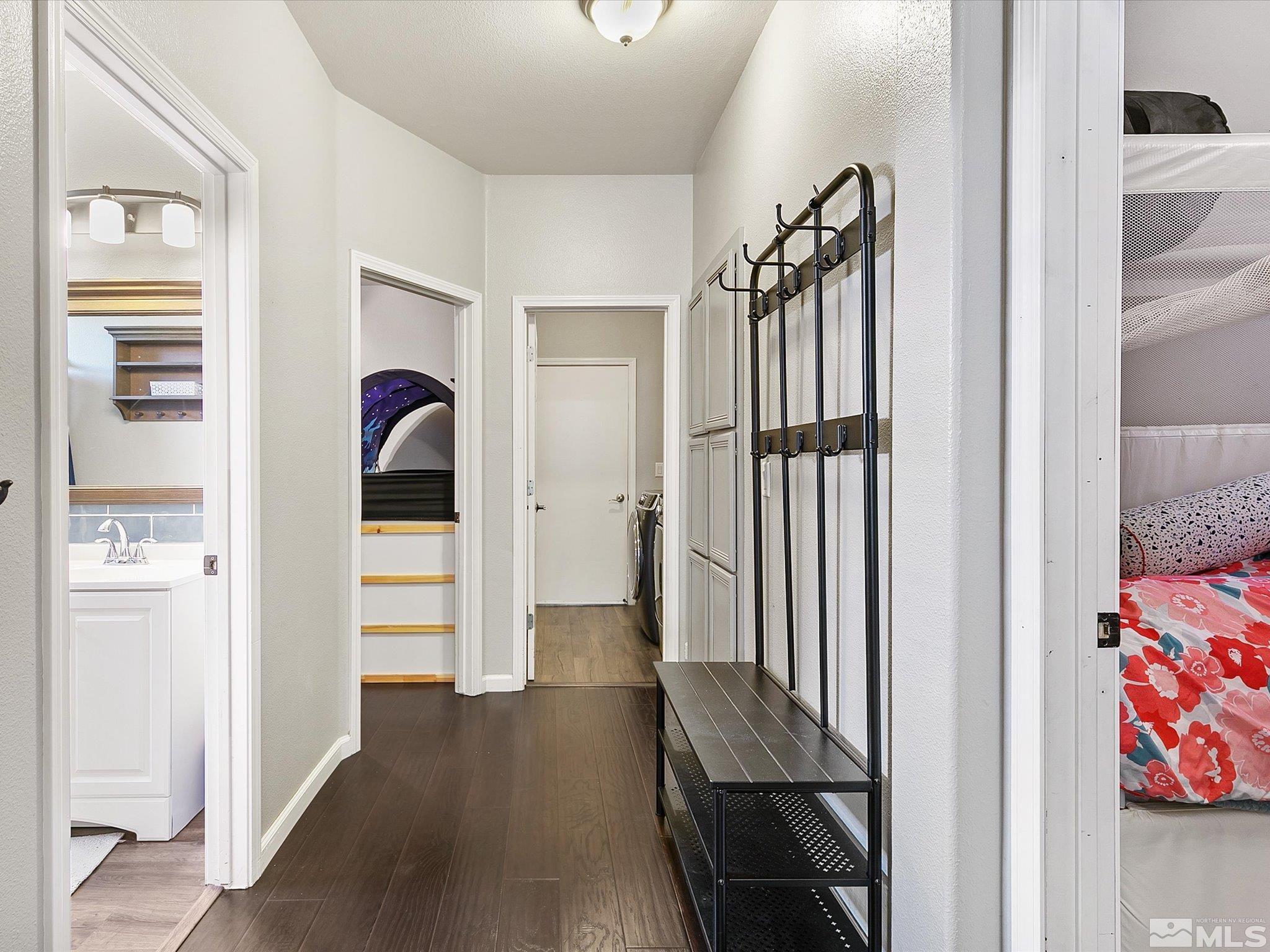 9740 Ripple Way Reno, NV 89521 - Photo 9 of 19 a view of hallway with furniture and wooden floor