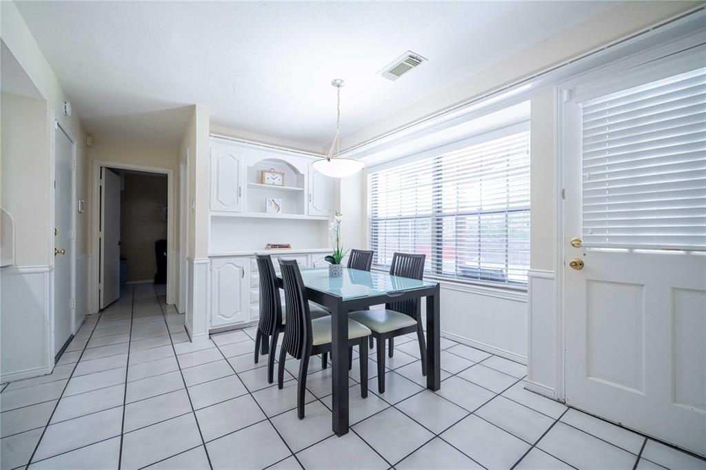 919 Green Hills Road Duncanville, TX 75137 - Photo 11 of 37 Dining space with light tile patterned flooring and baseboards