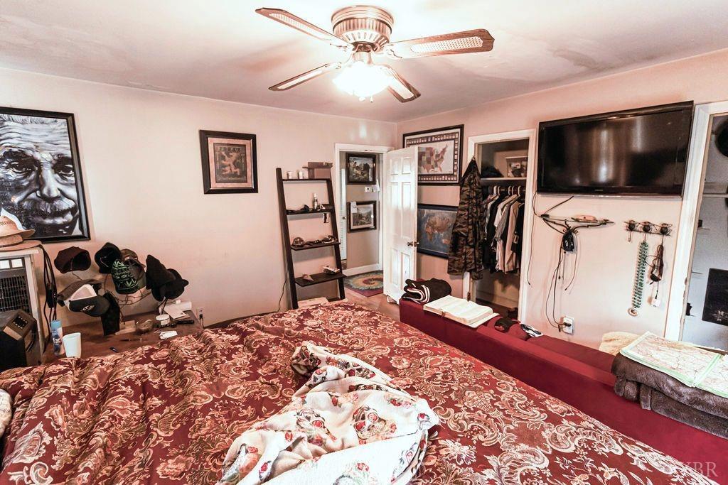1093 Mt Laurel Road Clover, VA 24534 - Photo 8 of 17 a bedroom with a bed and a flat screen tv