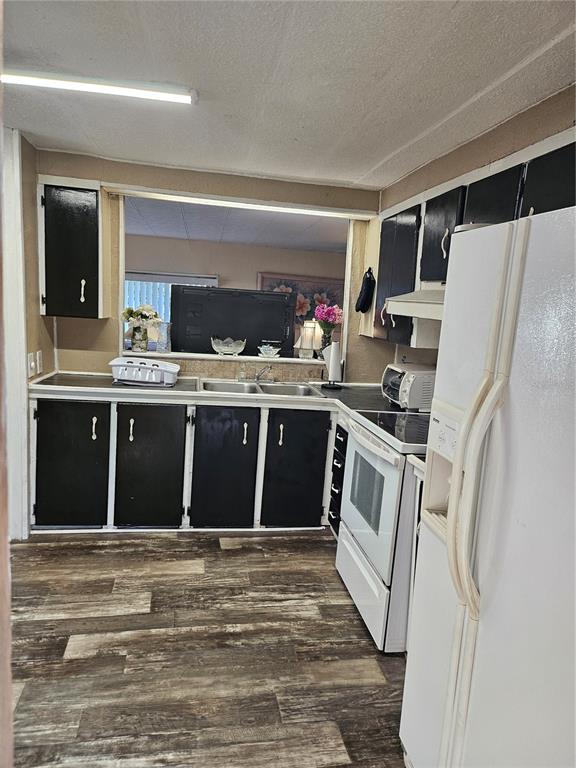 7657 North Caesar Point Dunnellon, FL 34433 - Photo 12 of 20 a kitchen with a stove top oven and refrigerator
