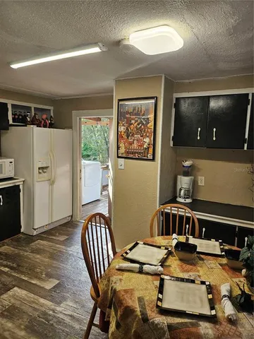 a kitchen with a table and chairs