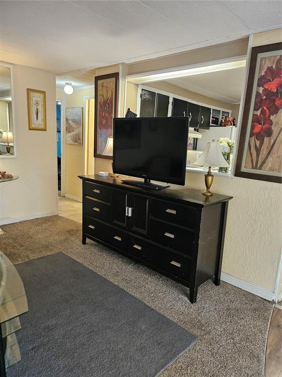 7657 North Caesar Point Dunnellon, FL 34433 - Photo 16 of 20 a living room with furniture and a flat screen tv