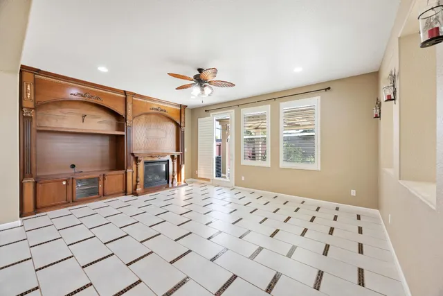 a kitchen with a stove sink and cabinets
