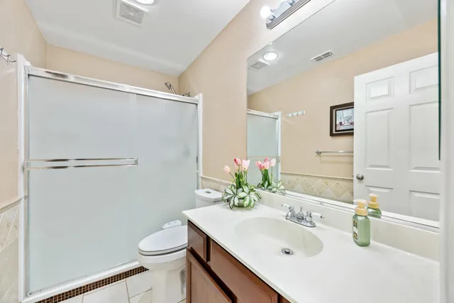 a view of multiple houses with city street