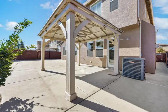 a large white kitchen with a large window
