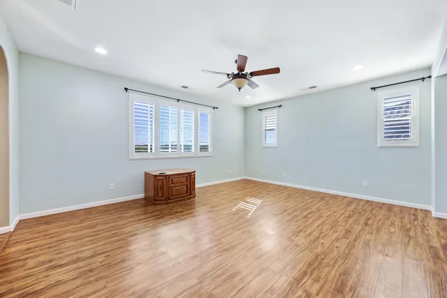 a white toilet sitting next to a bathroom sink