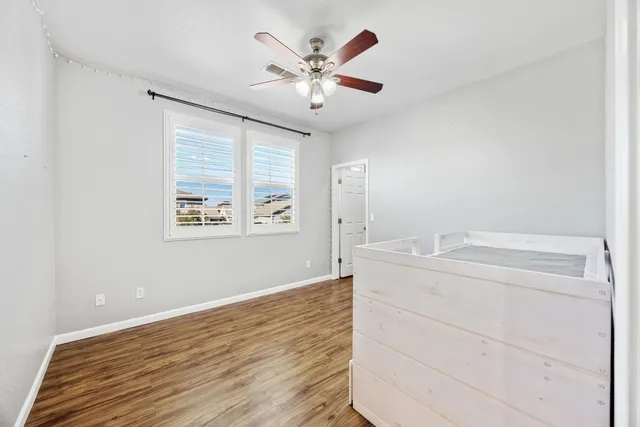 an aerial view of residential houses with city view