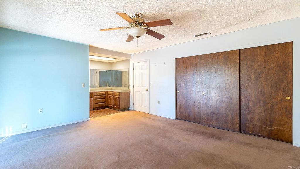 1002 Summer Glen Road Ramona, CA 92065 - Photo 21 of 40 a view of a livingroom with a ceiling fan and entryway