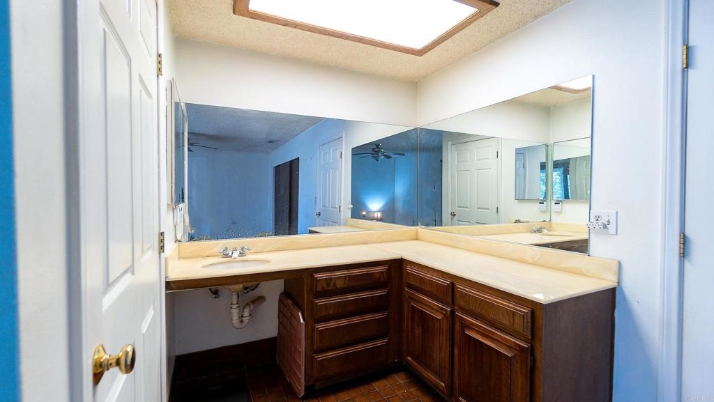 1002 Summer Glen Road Ramona, CA 92065 - Photo 22 of 40 a bathroom with a sink and a mirror