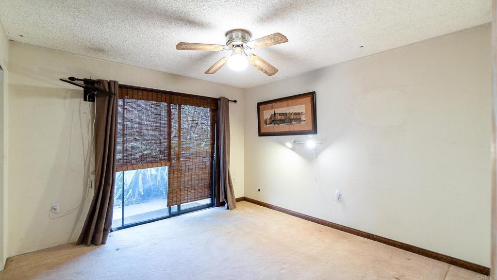1002 Summer Glen Road Ramona, CA 92065 - Photo 23 of 40 an empty room with chandelier fan
