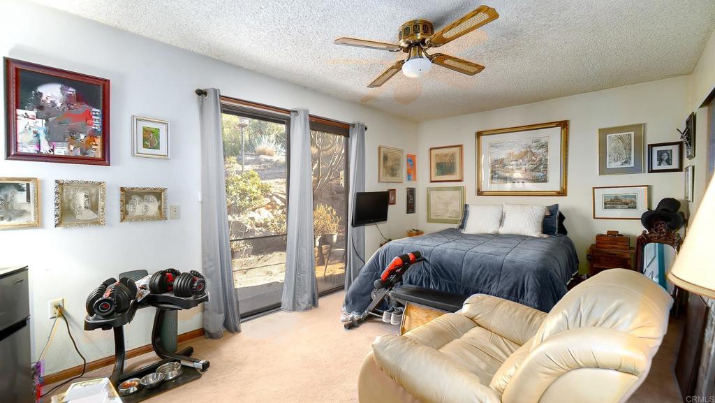 1002 Summer Glen Road Ramona, CA 92065 - Photo 25 of 40 a living room with furniture a couch and a window