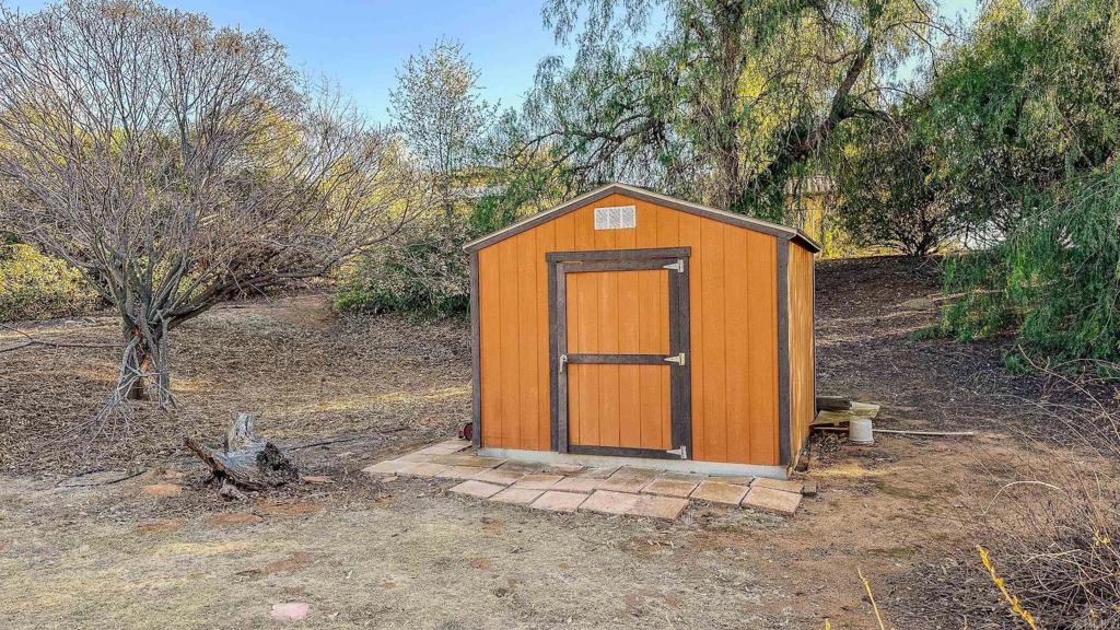 1002 Summer Glen Road Ramona, CA 92065 - Photo 34 of 40 a front view of a house with a yard