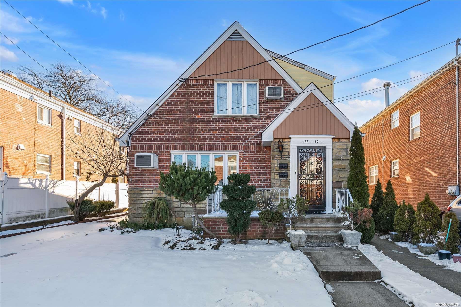 a front view of a house with sitting area