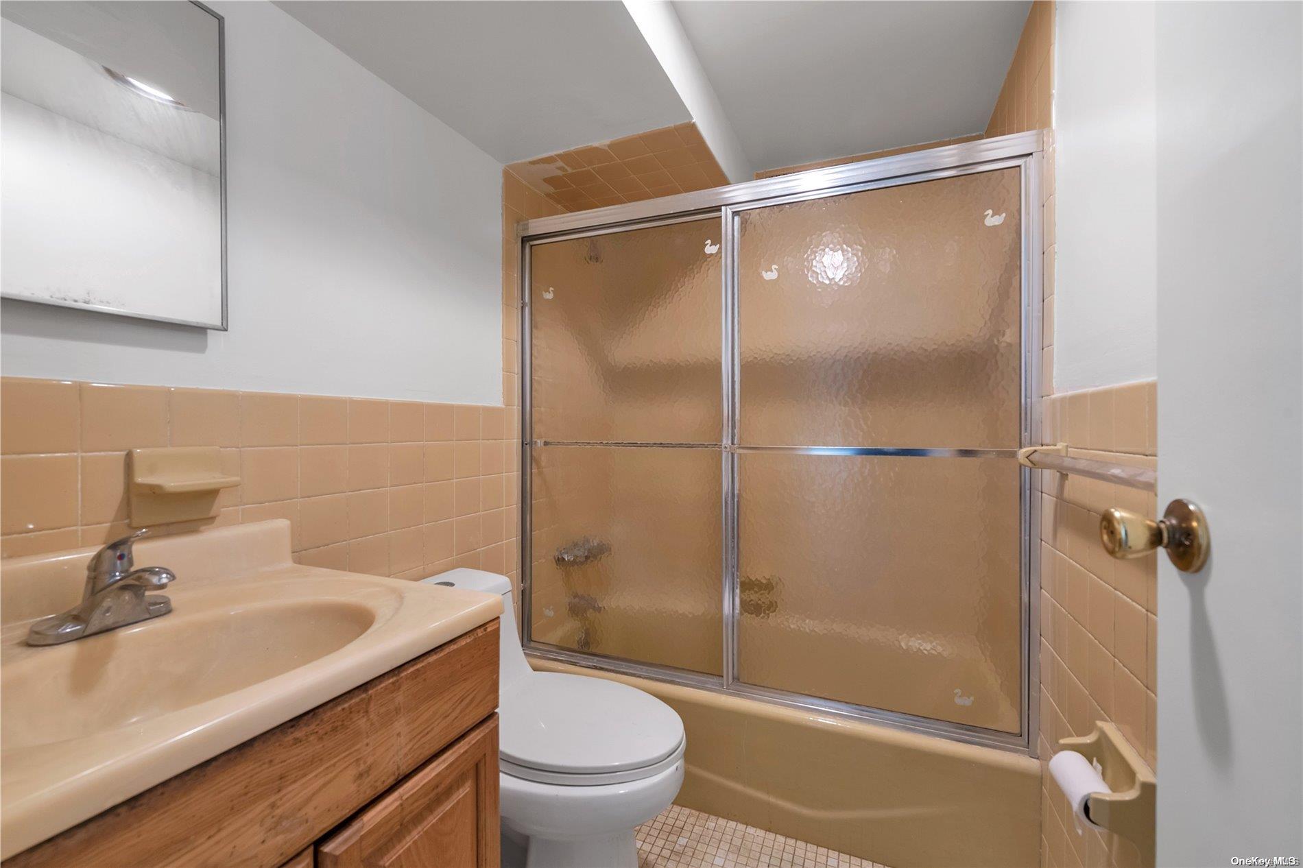 166-40 15th Drive Queens, NY 11357 - Photo 16 of 28 a bathroom with a sink toilet and shower