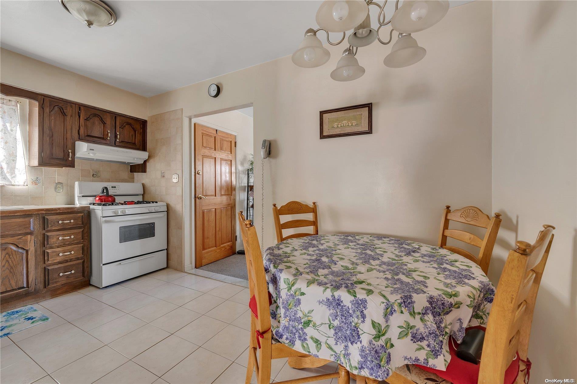 166-40 15th Drive Queens, NY 11357 - Photo 20 of 28 a bedroom with a bed and cabinets