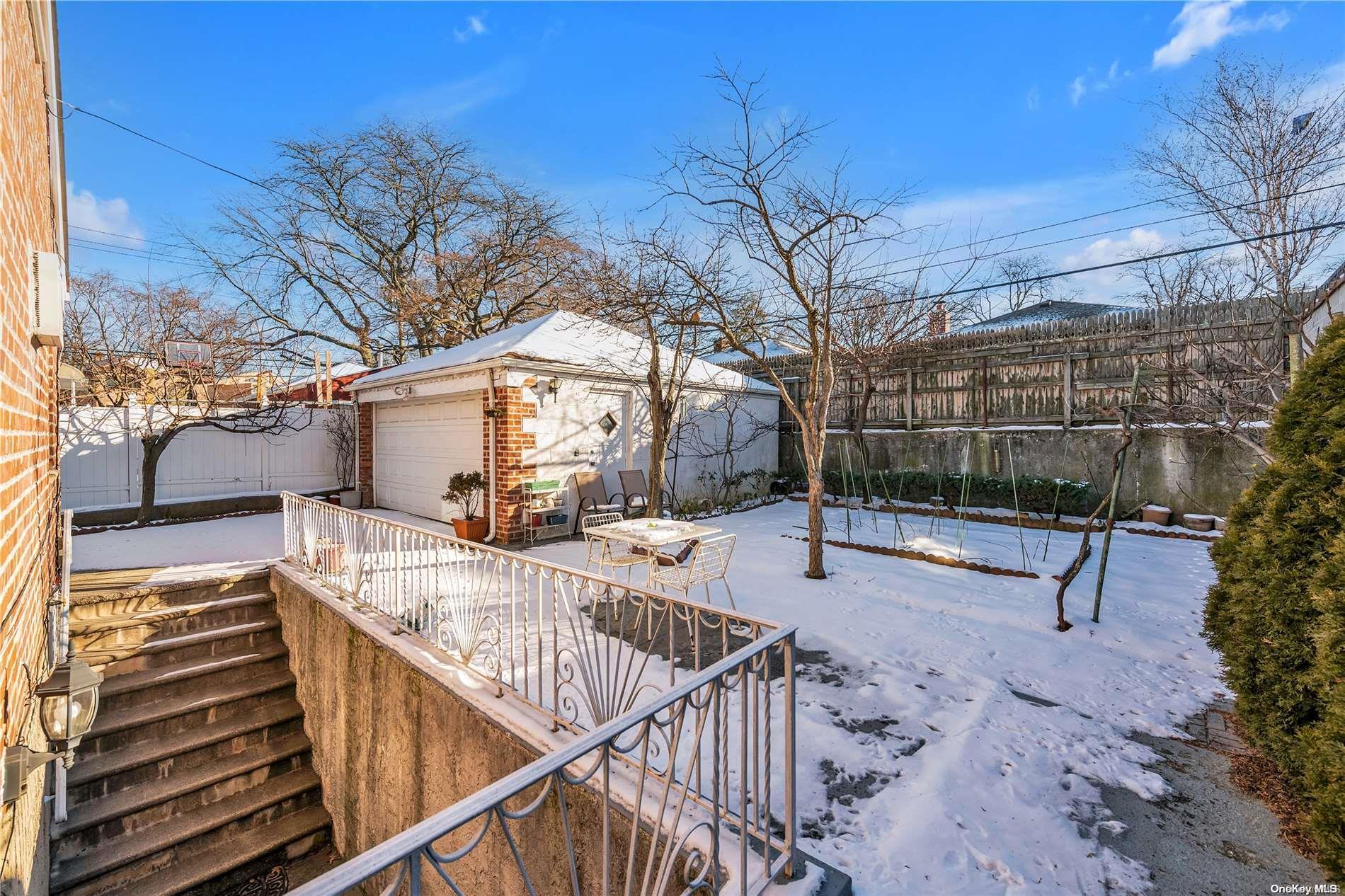166-40 15th Drive Queens, NY 11357 - Photo 25 of 28 a view of a patio with a yard