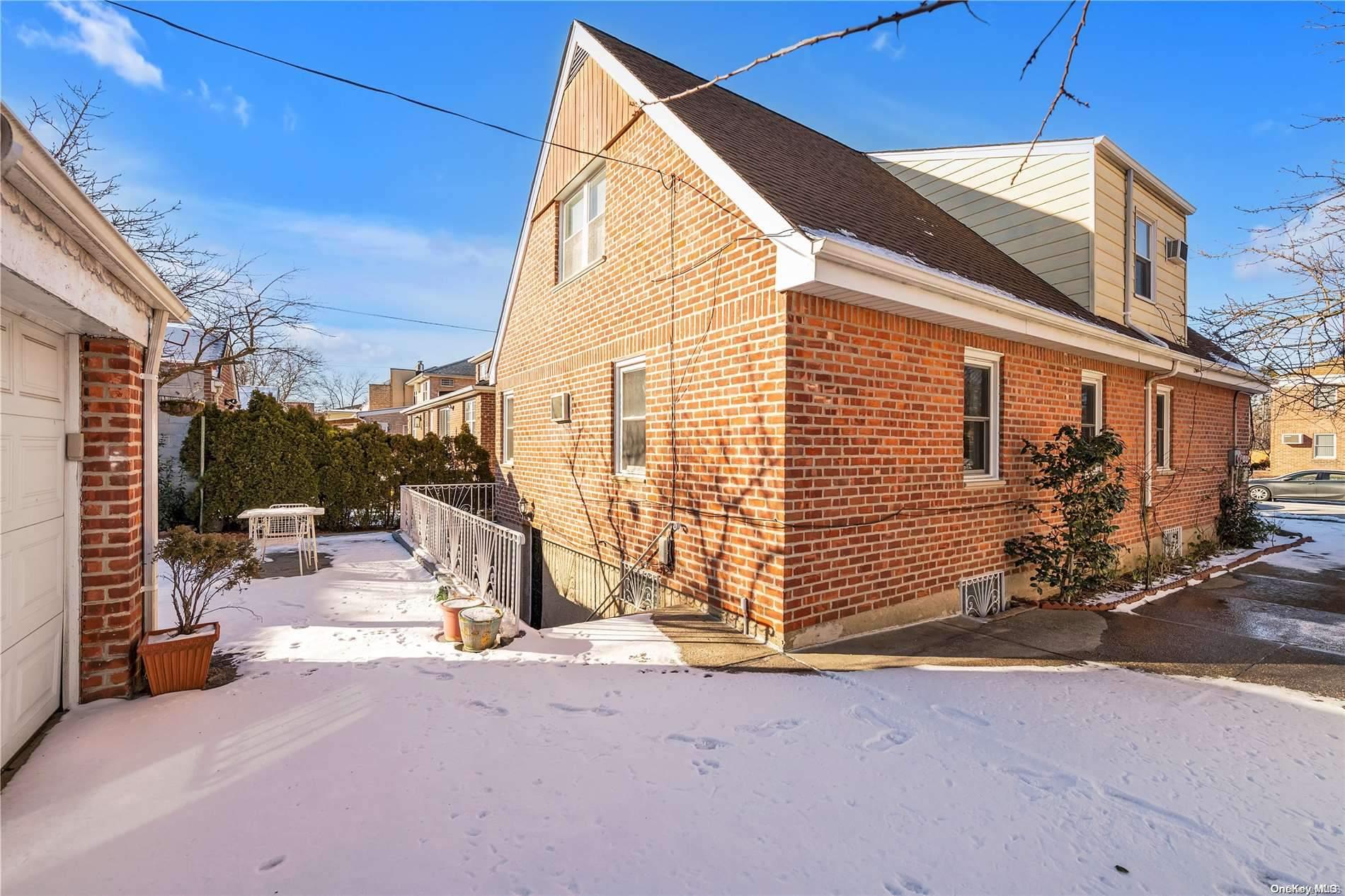 166-40 15th Drive Queens, NY 11357 - Photo 28 of 28 a view of a blue house with outdoor space