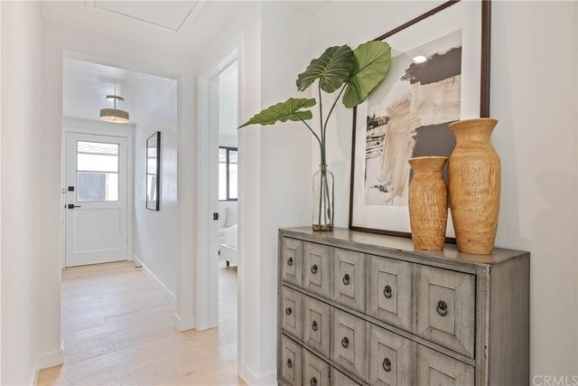 an empty room with potted plants