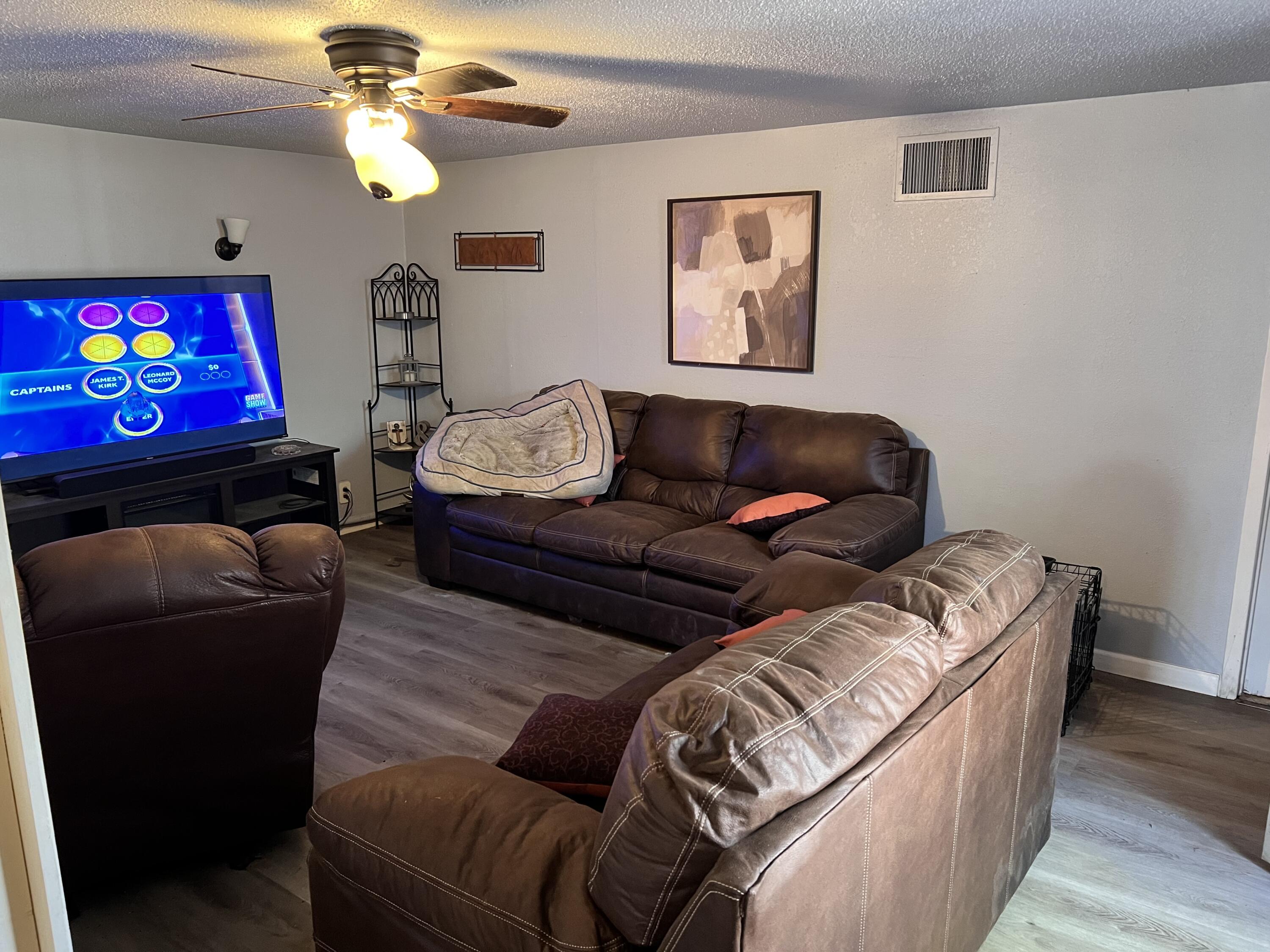1801 East 2nd Street Lubbock, TX 79403 - Photo 5 of 7 a living room with furniture and a fireplace
