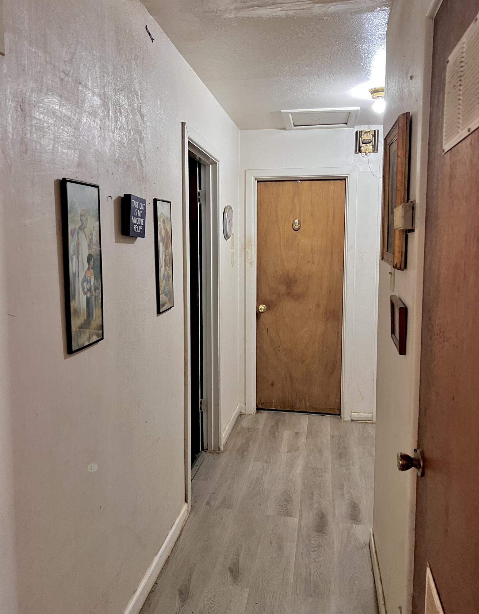 1801 East 2nd Street Lubbock, TX 79403 - Photo 6 of 7 a view of a hallway with wooden floor and entryway