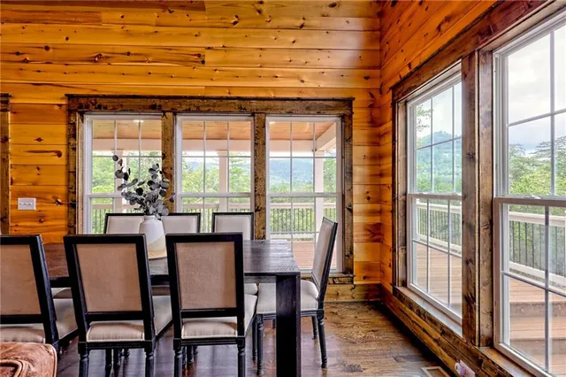 a living room with fireplace furniture and a wooden floor