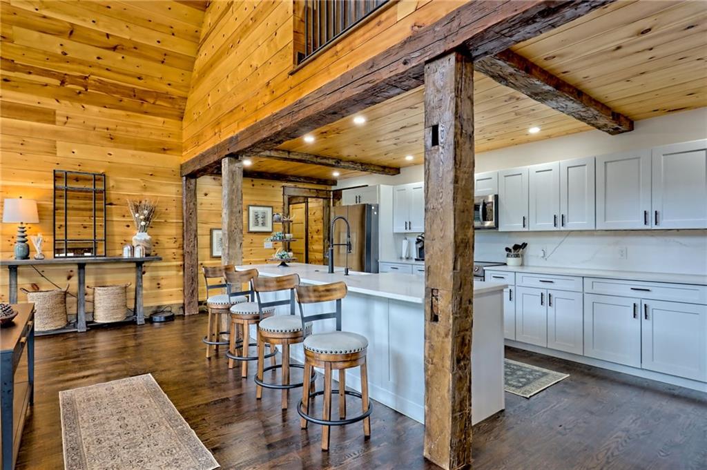 63 Redwood Lane Tiger, GA 30576 - Photo 22 of 77 a view of a kitchen with granite countertop lots of wooden cabinets and stainless steel appliances