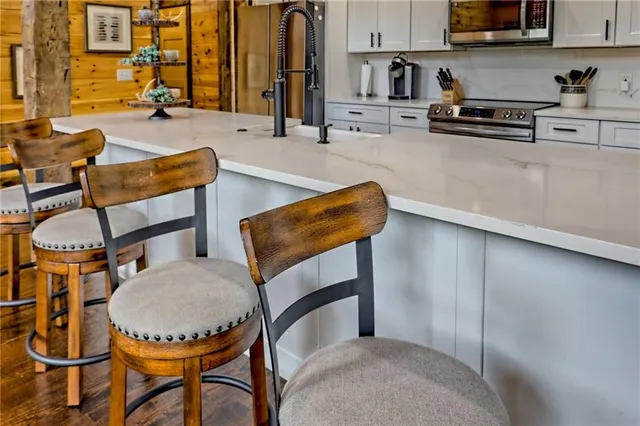 a spacious bedroom with a bed and a view of bathroom