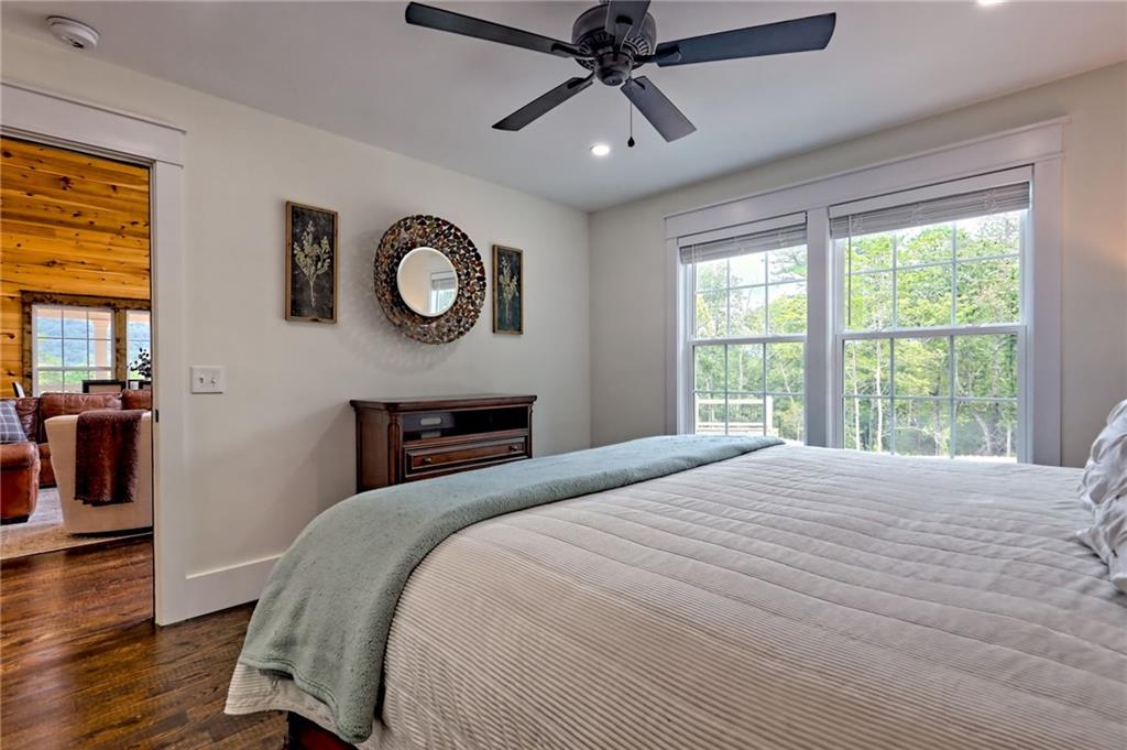 63 Redwood Lane Tiger, GA 30576 - Photo 34 of 77 a bedroom with a bed and a window