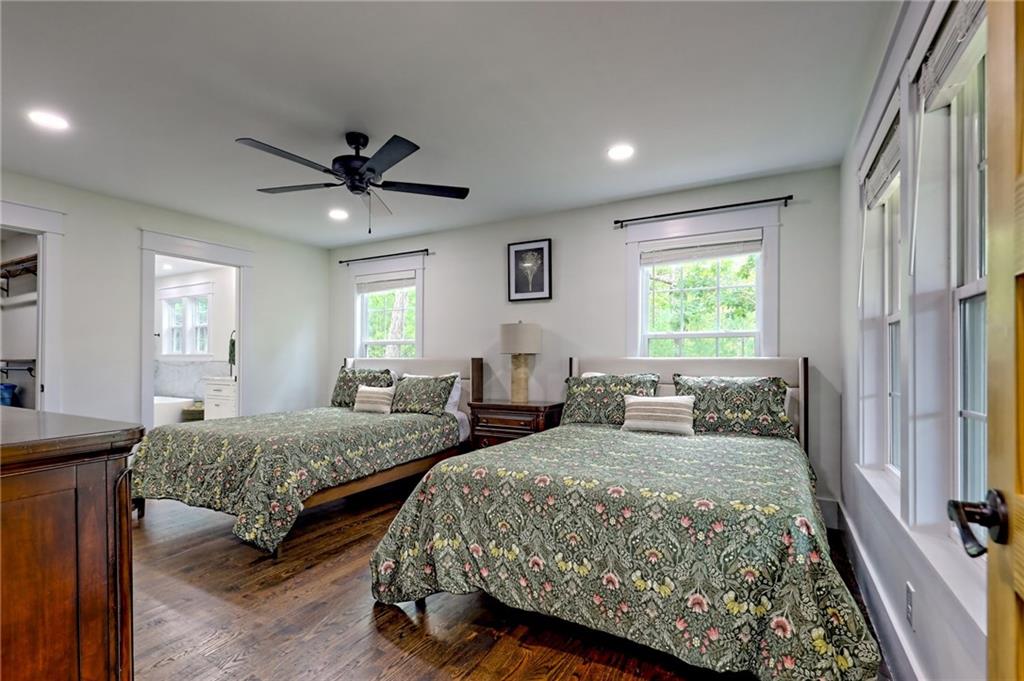 63 Redwood Lane Tiger, GA 30576 - Photo 37 of 77 a bedroom with two beds and a chandelier