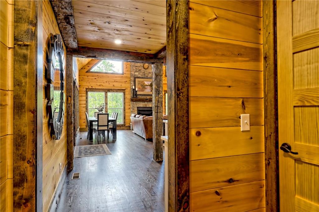 63 Redwood Lane Tiger, GA 30576 - Photo 49 of 77 a view of a hallway with wooden floor and furniture
