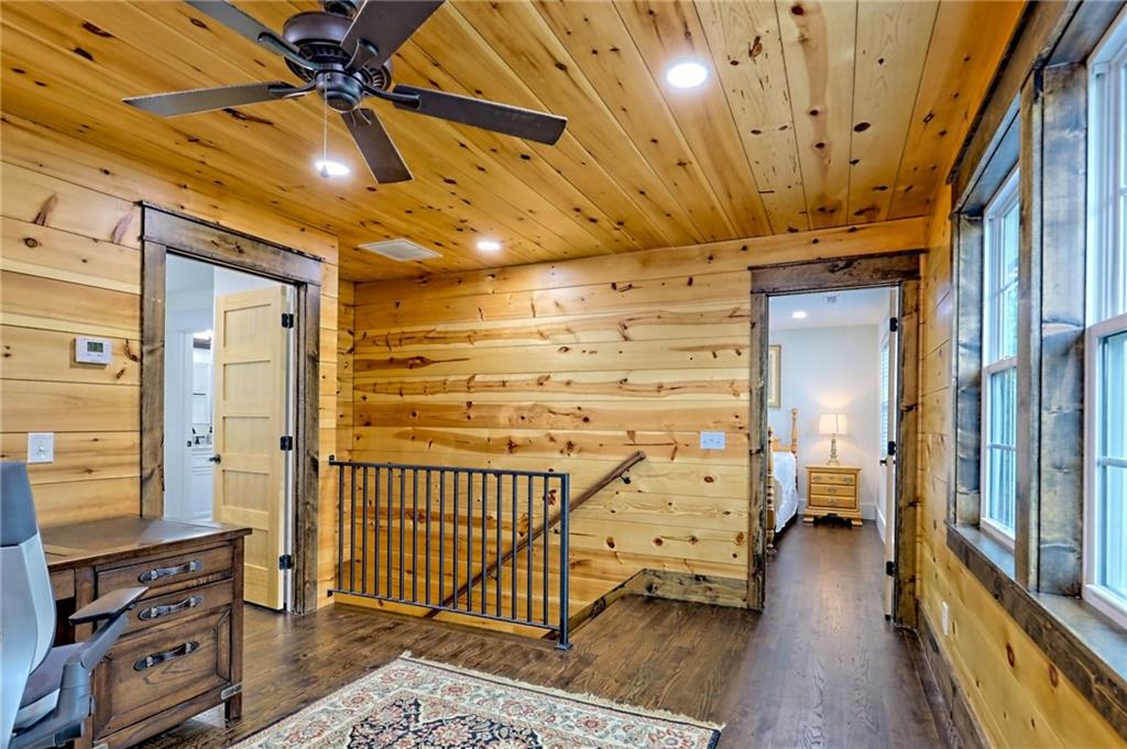 63 Redwood Lane Tiger, GA 30576 - Photo 60 of 77 a view of a hallway with wooden floor and staircase