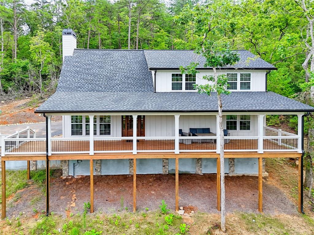 63 Redwood Lane Tiger, GA 30576 - Photo 6 of 77 a house with tall trees in the background