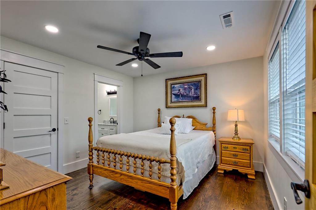 63 Redwood Lane Tiger, GA 30576 - Photo 62 of 77 a bedroom with a bed and a chandelier