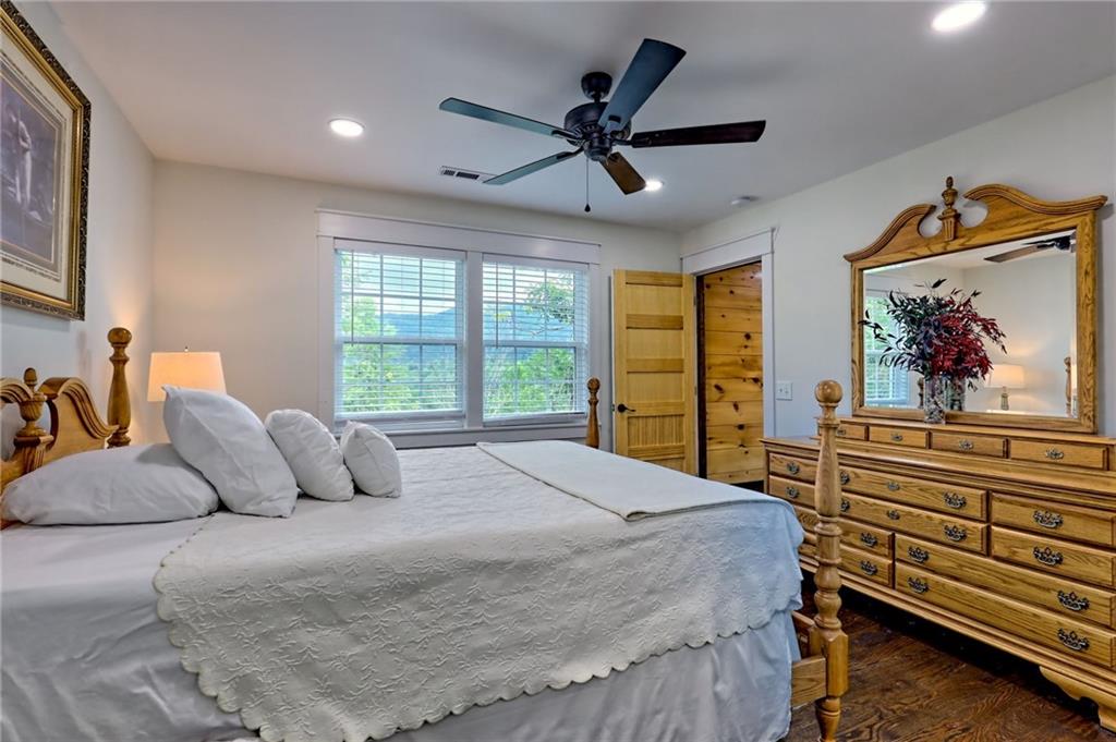 63 Redwood Lane Tiger, GA 30576 - Photo 65 of 77 a bedroom with a large bed and a window